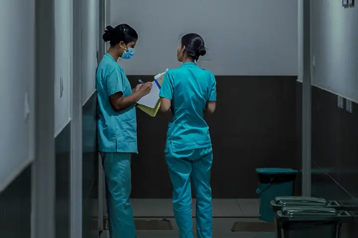 Nurses talking in a hospital corridor